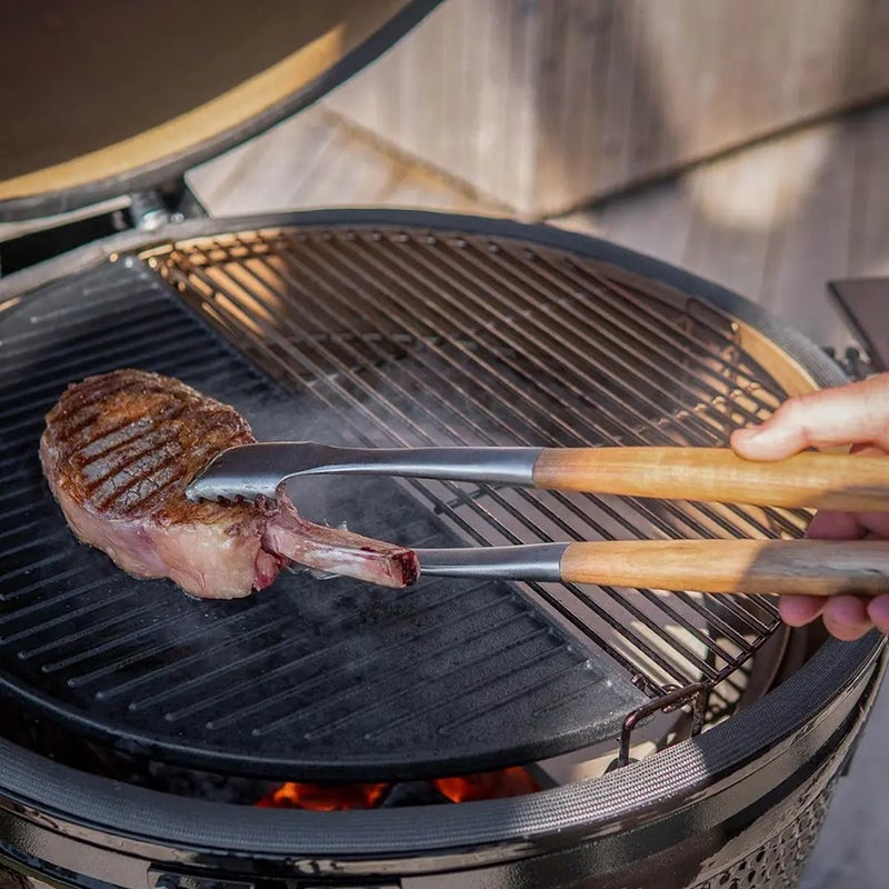 grill tongs made of Acacia wood and brushed stainless steel.